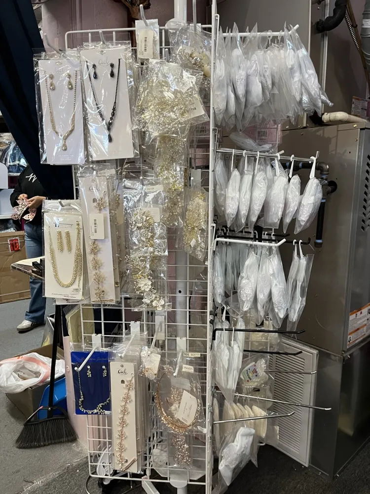 Necklace and earring sets on a display rack